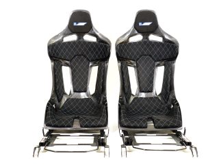 KevMannz GT-Max, a game-changing, non-reclinable full carbon fiber bucket seat that propels you forward with CTS-V plug&play rails and slider kit, and bespoke black Alcantara padding featuring a blue diamond stitching pattern and logo on the headrest padding - where every drive becomes a journey of limitless possibility.
